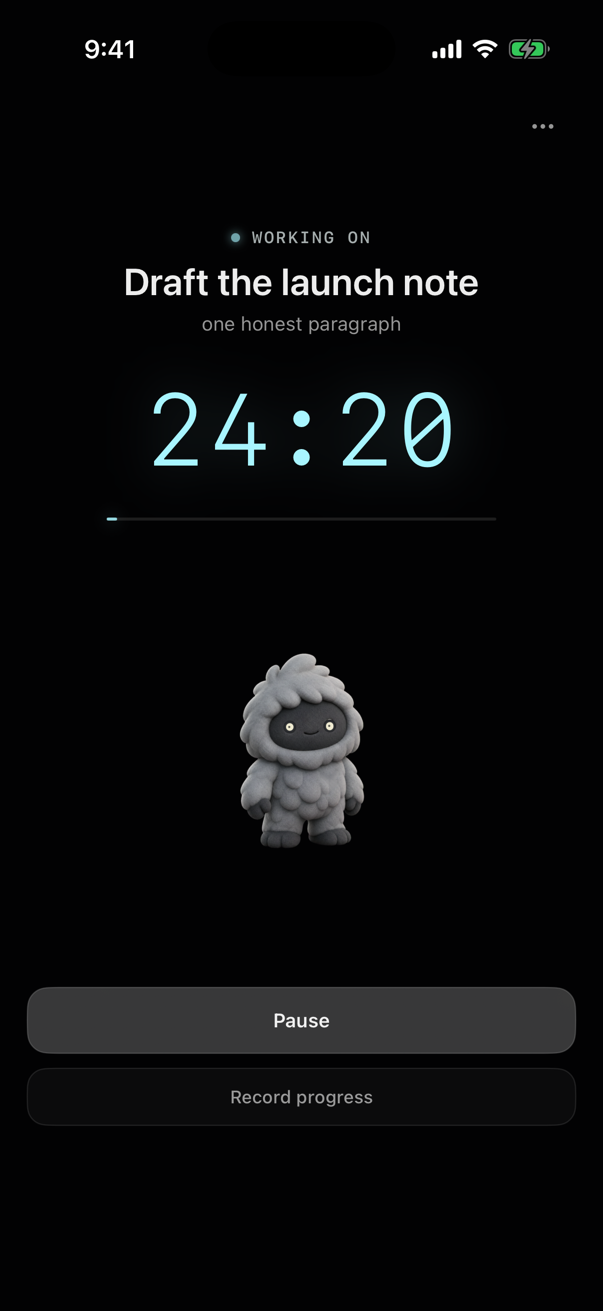 A focus block running in Stoiq on iPhone: “Working on — Draft the launch note”, the intention “one honest paragraph”, a 24:20 countdown, the companion standing below it, and Pause and Record progress buttons.